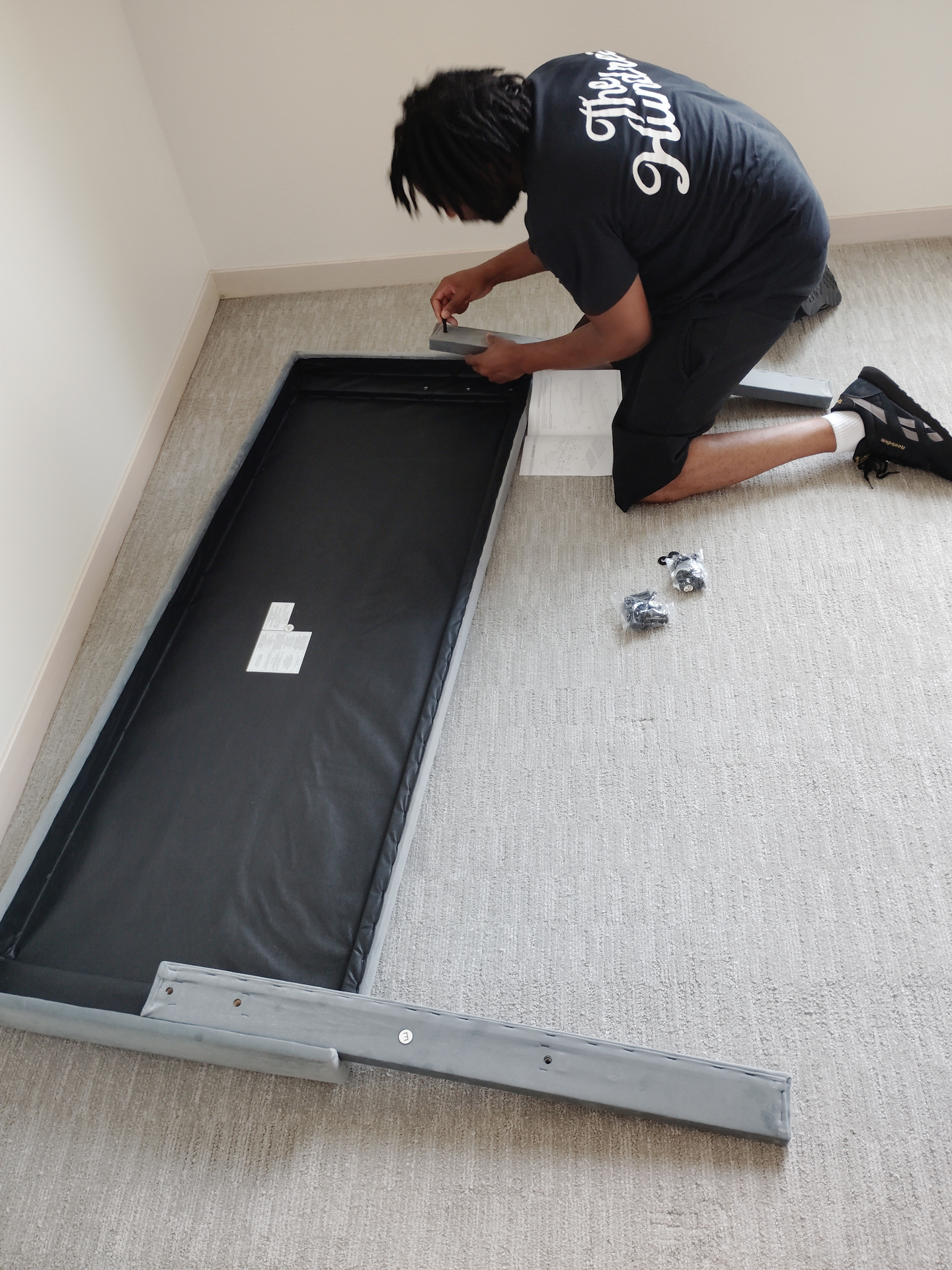 Attaching side rails to an upholstered bed base
